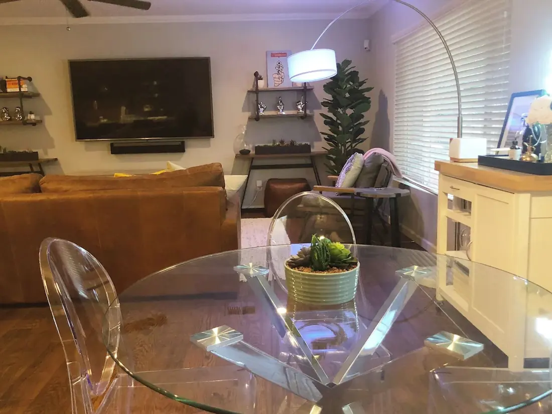 A dining table and living space set up for guests